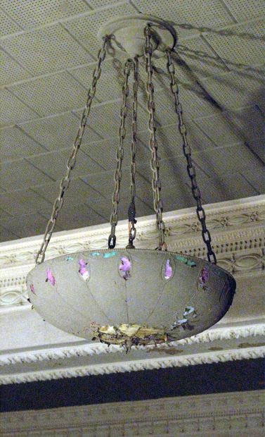 Stained glass light fixtures seen in March 2002